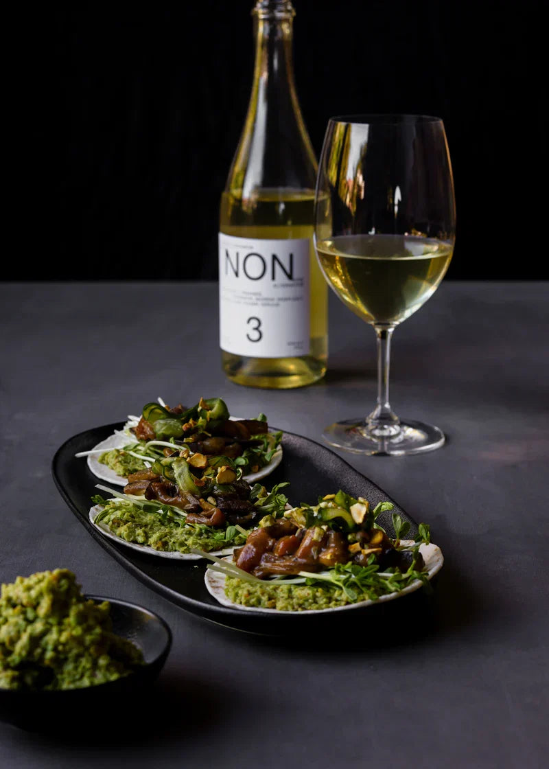 Miso-glazed eggplant tacos with edamame guacamole and pistachio